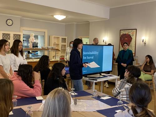 Student presenting Sustainability project at school assembly